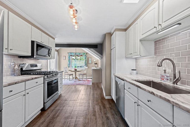 18 Chestnut Hill Rd, Simsbury, CT 06092 - kitchen with stainless steel appliances, white cabinetry, and backsplash
