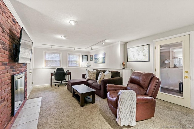 18 Chestnut Hill Rd, Simsbury, CT 06092 - living area with carpet, a brick fireplace, an office area, and track lighting