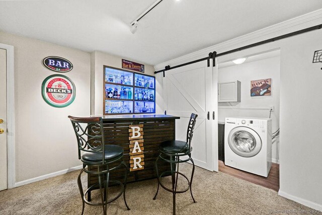 18 Chestnut Hill Rd, Simsbury, CT 06092 - laundry area featuring washer / clothes dryer, a barn door, cabinet space, carpet, and track lighting