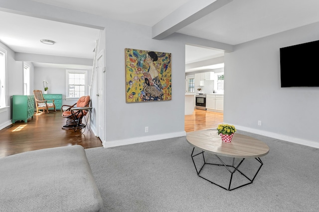 11 Margaret St, Norwalk, CT 06851 - living area featuring beam ceiling, light carpet, and light wood finished floors