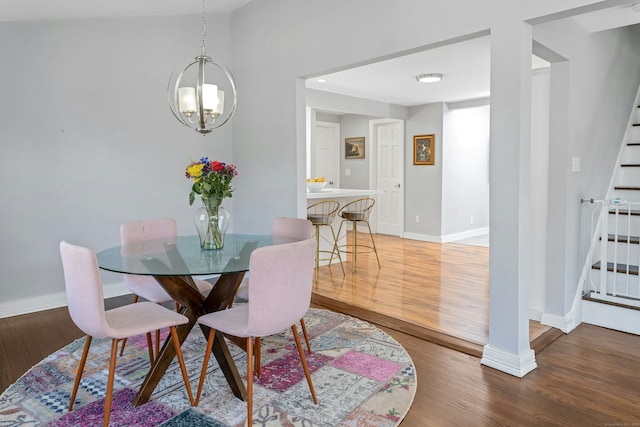 11 Margaret St, Norwalk, CT 06851 - dining room with stairs, light wood finished floors, and a chandelier