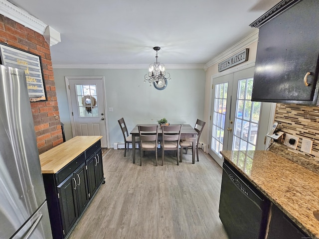 38 Sylvan Ave, Wallingford, CT 06492 - dining area featuring light wood-style floors, ornamental molding, french doors, and a chandelier