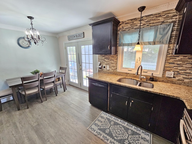 38 Sylvan Ave, Wallingford, CT 06492 - kitchen featuring black dishwasher, decorative backsplash, hanging light fixtures, ornamental molding, and light wood-style flooring