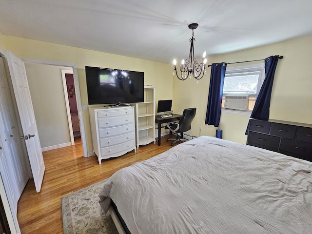 38 Sylvan Ave, Wallingford, CT 06492 - bedroom featuring light wood-style flooring, a chandelier, and cooling unit