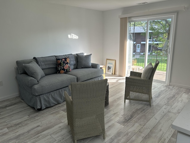 63 E Broadway Unit D, Milford, CT 06460 - living room featuring light wood-type flooring and baseboards