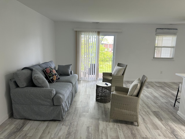 63 E Broadway Unit D, Milford, CT 06460 - living area featuring light wood-style floors and plenty of natural light