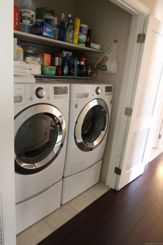 2337 Stanley St, New Britain, CT 06053 - laundry room featuring separate washer and dryer and tile patterned flooring