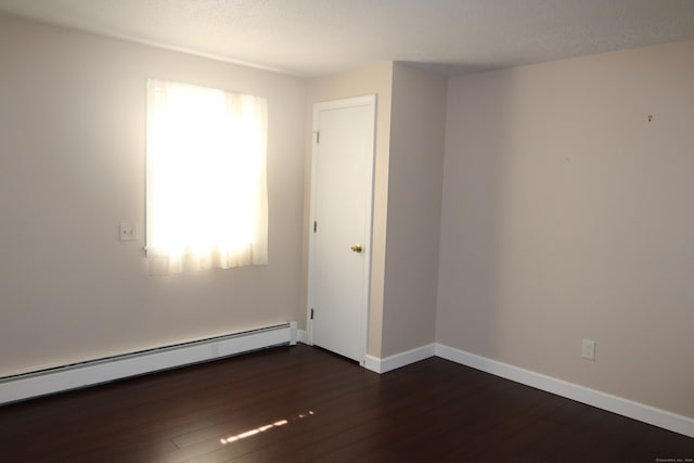 2337 Stanley St, New Britain, CT 06053 - empty room featuring a baseboard radiator, dark wood-style floors, and a textured ceiling