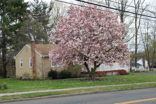 2337 Stanley St, New Britain, CT 06053 - view of side of home featuring a chimney and a lawn