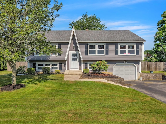 315 Judson Ave, Groton, CT 06355 - view of front facade featuring driveway, a garage, and a shingled roof