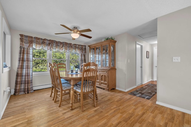 315 Judson Ave, Groton, CT 06355 - dining room featuring ceiling fan, a baseboard heating unit, and light wood-style flooring