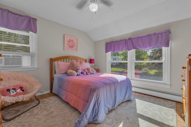 315 Judson Ave, Groton, CT 06355 - bedroom featuring a baseboard heating unit, multiple windows, wood finished floors, vaulted ceiling, and cooling unit