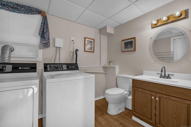 315 Judson Ave, Groton, CT 06355 - bathroom with washer and dryer, vanity, wood finished floors, and a paneled ceiling