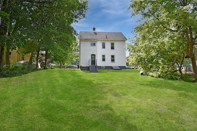31 Chapman St, New Britain, CT 06051 - back of house with a lawn and a chimney