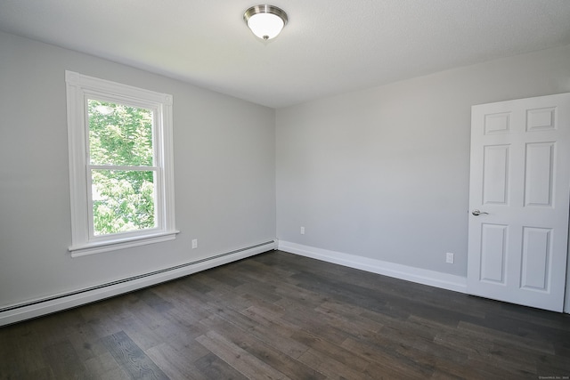 31 Chapman St, New Britain, CT 06051 - spare room featuring a baseboard heating unit and dark wood-type flooring