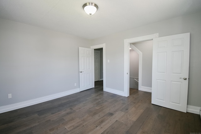 31 Chapman St, New Britain, CT 06051 - unfurnished bedroom with dark wood finished floors and baseboards