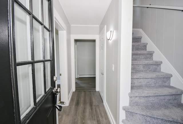 31 Chapman St, New Britain, CT 06051 - staircase with wood finished floors and a baseboard heating unit