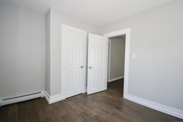 31 Chapman St, New Britain, CT 06051 - unfurnished bedroom with a baseboard radiator, dark wood finished floors, and a closet