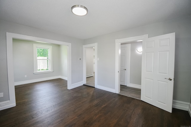 31 Chapman St, New Britain, CT 06051 - unfurnished bedroom with dark wood-type flooring and baseboard heating