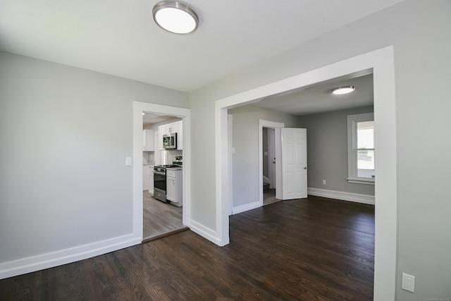 31 Chapman St, New Britain, CT 06051 - unfurnished room featuring baseboards and dark wood-style floors