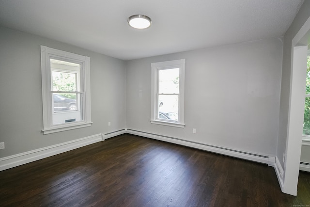 31 Chapman St, New Britain, CT 06051 - spare room with a baseboard heating unit and dark wood-style flooring