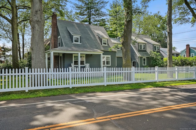 2 Clearview Ave, Norwalk, CT 06851 - view of front of property featuring covered porch, a chimney, and a fenced front yard