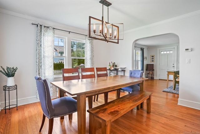 2 Clearview Ave, Norwalk, CT 06851 - dining area with arched walkways, ornamental molding, light wood finished floors, and a chandelier