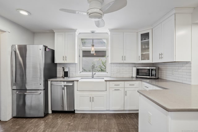 2 Clearview Ave, Norwalk, CT 06851 - kitchen with stainless steel appliances, white cabinets, a ceiling fan, and dark wood-style floors