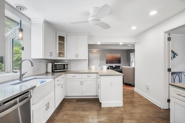 2 Clearview Ave, Norwalk, CT 06851 - kitchen with appliances with stainless steel finishes, ceiling fan, a peninsula, plenty of natural light, and recessed lighting