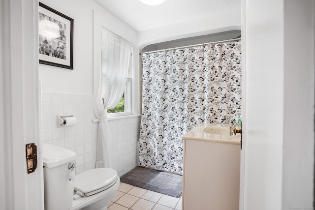 2 Clearview Ave, Norwalk, CT 06851 - full bath featuring tile patterned floors, tile walls, vanity, a shower with shower curtain, and wainscoting
