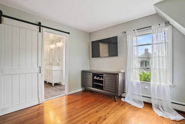 2 Clearview Ave, Norwalk, CT 06851 - unfurnished living room with a barn door and light wood finished floors
