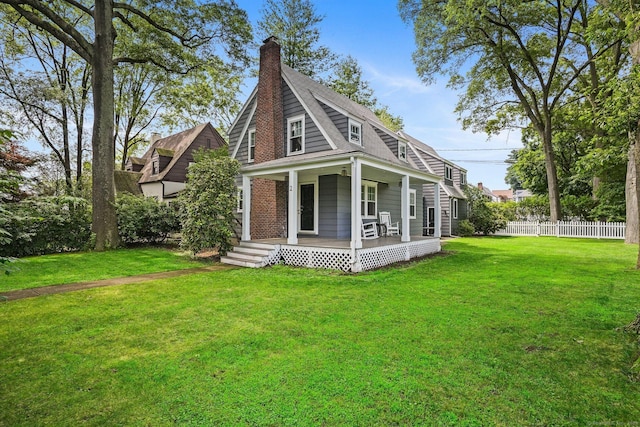 2 Clearview Ave, Norwalk, CT 06851 - view of side of property with covered porch, a chimney, and roof with shingles