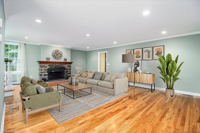 1384 N Benson Rd, Fairfield, CT 06824 - living room with recessed lighting, wood finished floors, crown molding, a stone fireplace, and baseboard heating