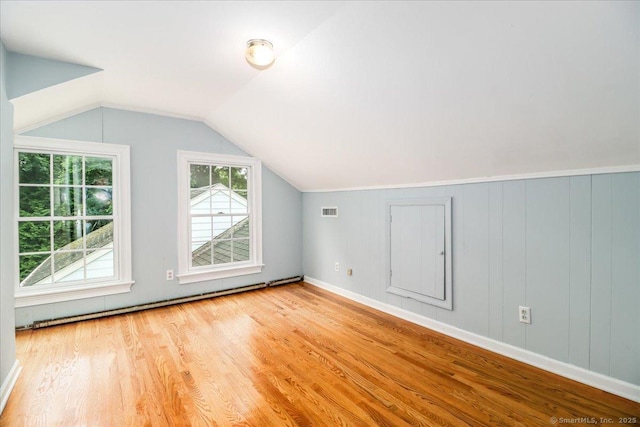 1384 N Benson Rd, Fairfield, CT 06824 - additional living space featuring wood finished floors, lofted ceiling, and a baseboard heating unit