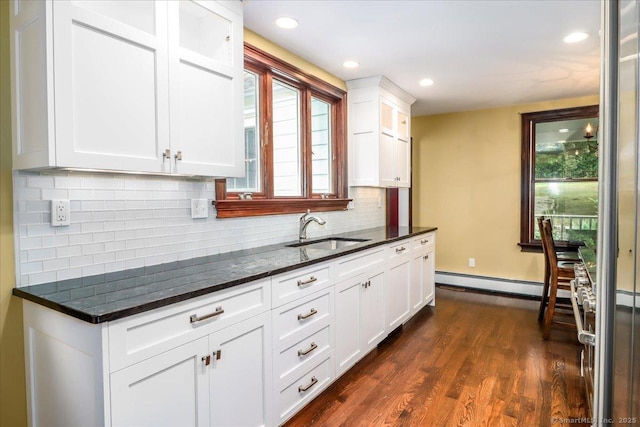 1384 N Benson Rd, Fairfield, CT 06824 - kitchen with healthy amount of natural light, white cabinets, dark wood finished floors, decorative backsplash, and recessed lighting