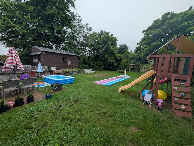 56 Mitchell St, New Britain, CT 06053 - view of green lawn featuring a playground