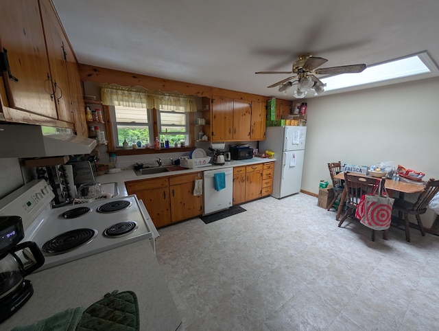 56 Mitchell St, New Britain, CT 06053 - kitchen with white appliances, under cabinet range hood, light countertops, a ceiling fan, and brown cabinets