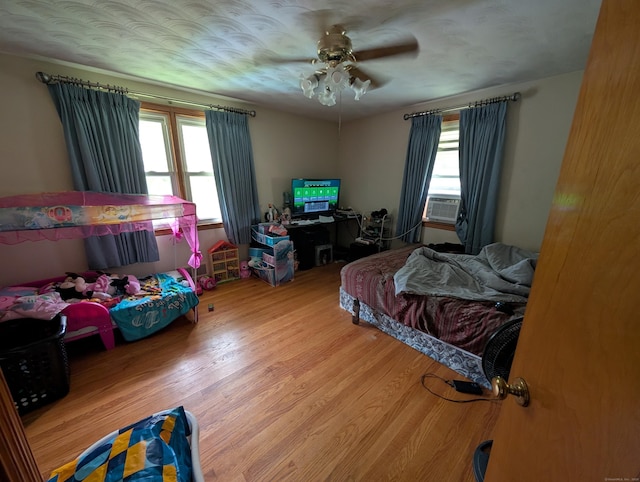 56 Mitchell St, New Britain, CT 06053 - bedroom with wood finished floors, a ceiling fan, and cooling unit