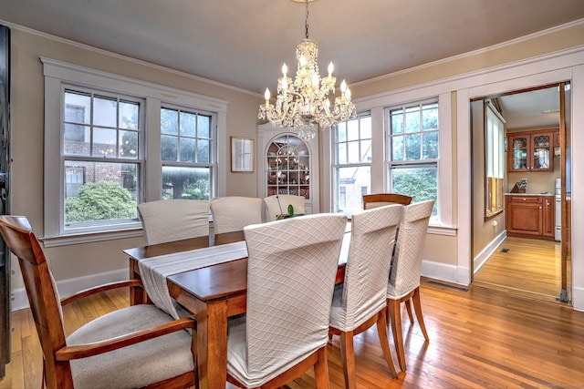 150 Westwood Rd, New Haven, CT 06515 - dining area featuring light wood-style floors, healthy amount of natural light, a chandelier, and ornamental molding
