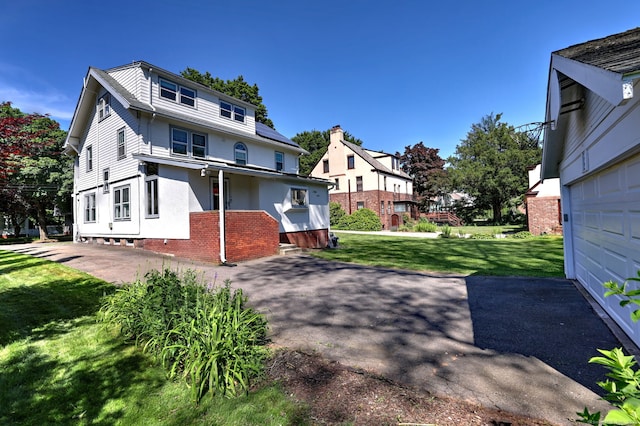 150 Westwood Rd, New Haven, CT 06515 - back of property with a lawn and a garage