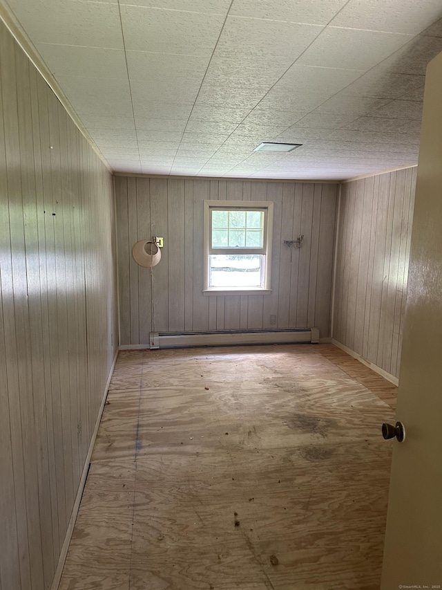 29 Orchard Hill Rd, Newtown, CT 06470 - spare room featuring baseboard heating and wood walls