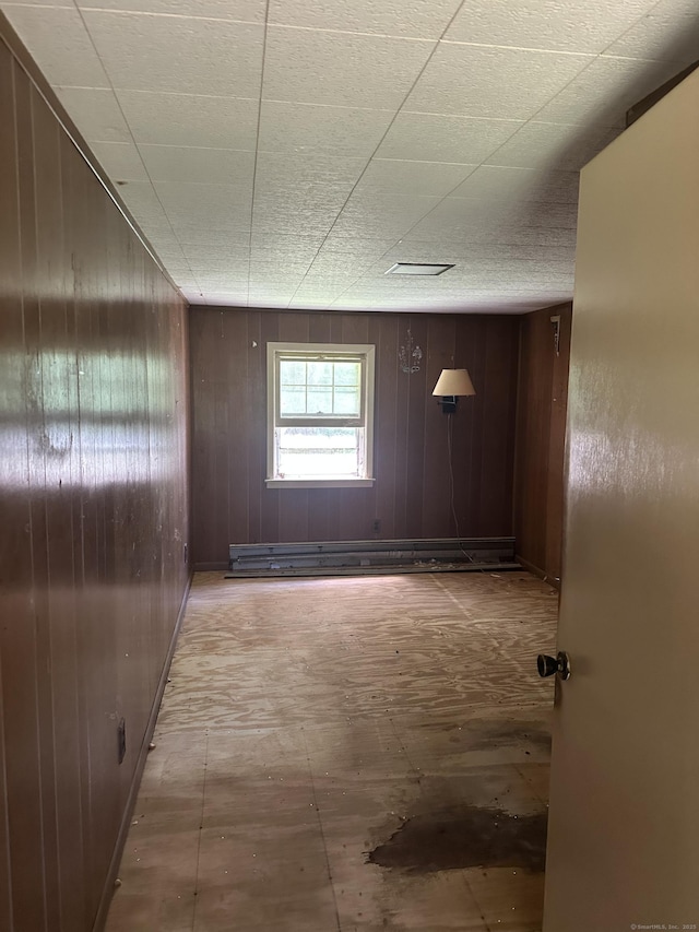 29 Orchard Hill Rd, Newtown, CT 06470 - hall with wood walls and a baseboard radiator