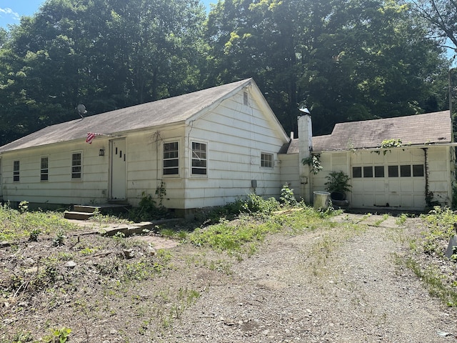 29 Orchard Hill Rd, Newtown, CT 06470 - view of front of property featuring driveway and an attached garage
