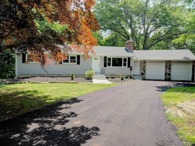 185 Hope Valley Rd, Hebron, CT 06231 - ranch-style house featuring a garage, a chimney, and driveway