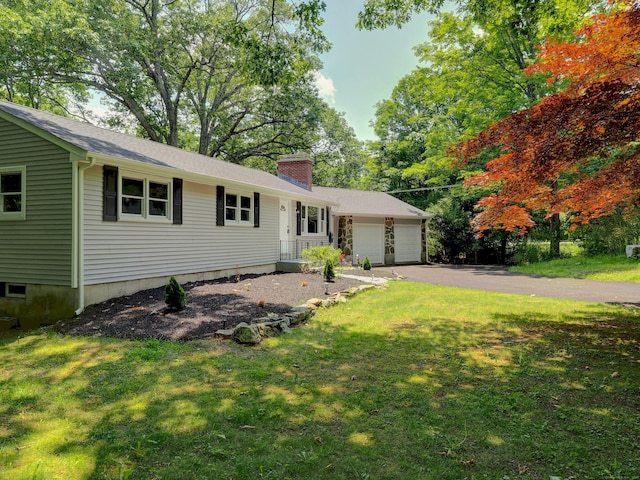 185 Hope Valley Rd, Hebron, CT 06231 - ranch-style house with a chimney, an attached garage, driveway, and a front lawn