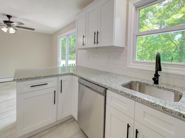 185 Hope Valley Rd, Hebron, CT 06231 - kitchen with stainless steel dishwasher, a peninsula, a ceiling fan, tasteful backsplash, and white cabinets