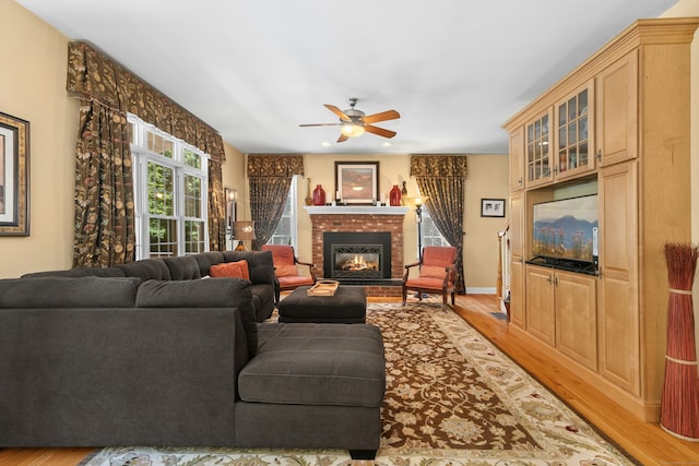 20 Lisbon Ter, Oxford, CT 06478 - living room featuring light wood-style floors, a ceiling fan, and a fireplace