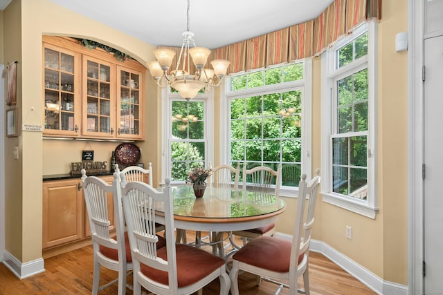 20 Lisbon Ter, Oxford, CT 06478 - dining space featuring a chandelier, light wood finished floors, and healthy amount of natural light