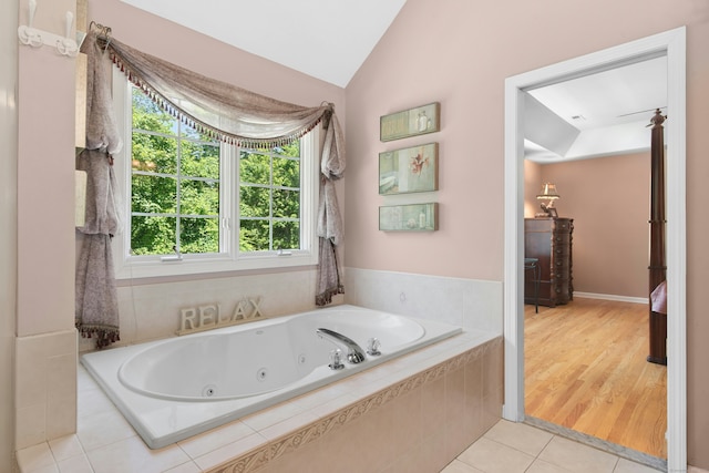 20 Lisbon Ter, Oxford, CT 06478 - bathroom with a jetted tub, vaulted ceiling, and tile patterned flooring