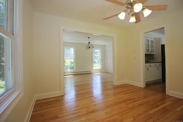 1 Quaker Ridge Rd, Sherman, CT 06784 - empty room with baseboard heating, light wood-style floors, and a ceiling fan
